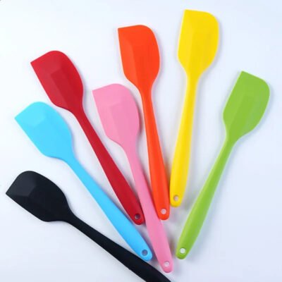 a group of colorful plastic spatulas